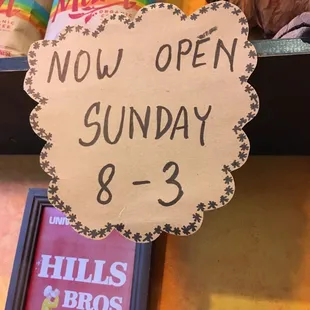 an open sunday sign