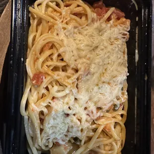 a pasta dish in a plastic container
