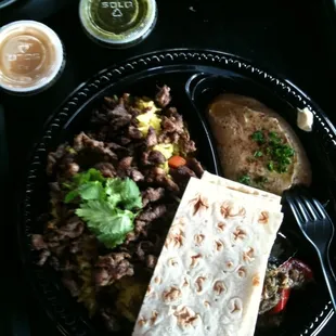 Lamb on rice with two sides