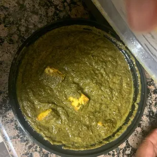 a bowl of green food