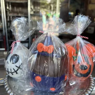 three chocolate eggs wrapped in plastic bags