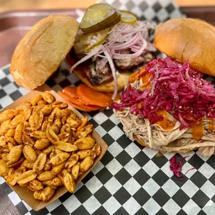 Spicy smoked peanuts, pulled pork sandwich, and beef brisket sandwich
