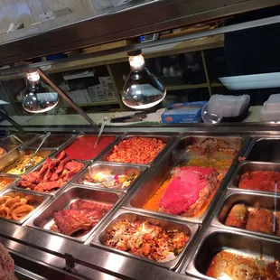 a woman standing in front of a buffet