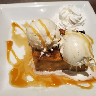 a dessert with ice cream and caramel sauce