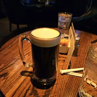 a glass of beer on a table