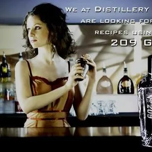 a woman holding a bottle of liquor