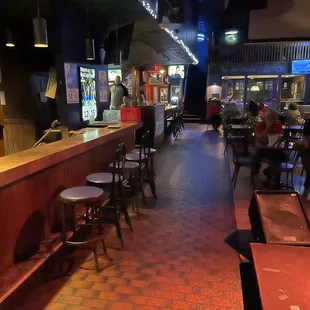 the bar and seating area of a restaurant