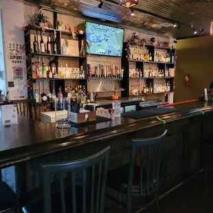 a bar with a large screen tv