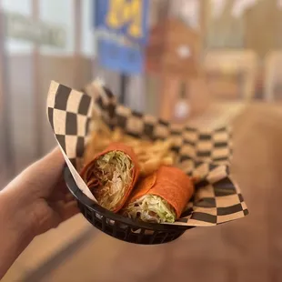 a person holding a basket of food