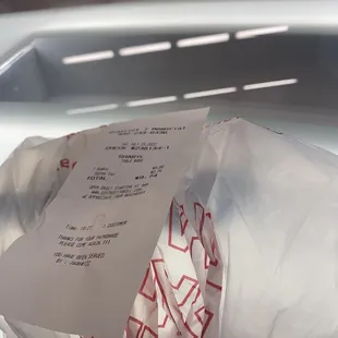 a receipt in a plastic bag
