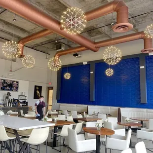 a restaurant with a large blue wall