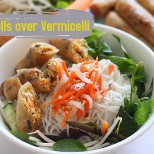 a bowl of noodles, meat, and vegetables