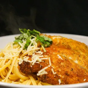 a plate of pasta and chicken