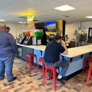 a group of people sitting at a counter