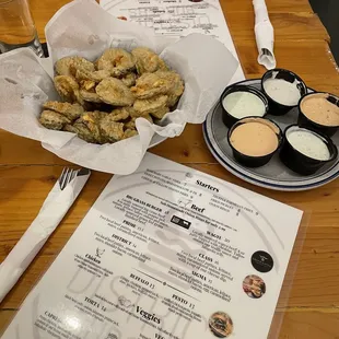 a plate of fried food and a menu