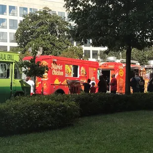 food trucks parked in front of a building