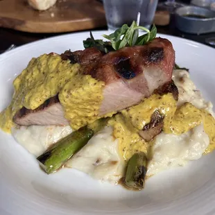 Pork chop with cheddar smashed potatoes and asparagus