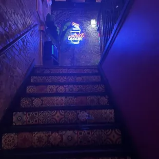 a man walking up a flight of stairs