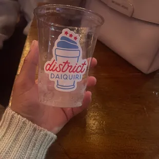 a person holding a drink
