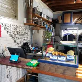 a counter with a laptop on it