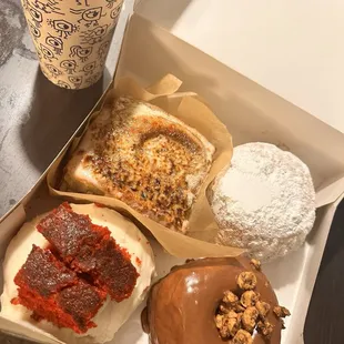 clockwise from top left: Cinnamon Roll  Beignet donut with coffee cream filling  Nutella Mousse Donut  Red Velvet Donut