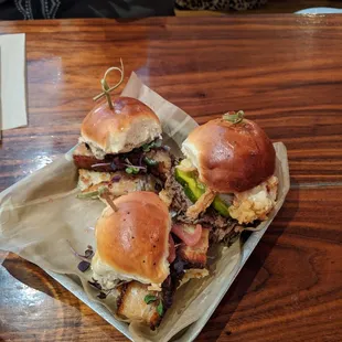 Two pork belly sliders and one brisket slider