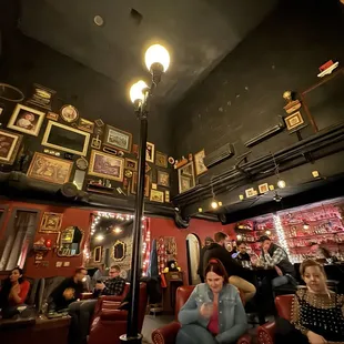 a group of people sitting in a bar