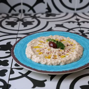 a plate of food on a tiled floor