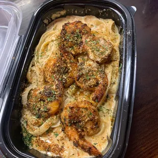 Fettuccine Alfredo with grilled shrimp/ tied fish oh wow!! this place is recommended 5/5 a must try mouth watering delicious hot spot