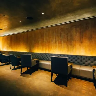 a row of chairs in a dimly lit room