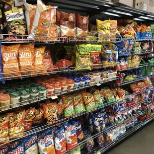 Assorted large bags of chips and dips