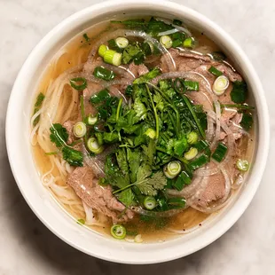 Pho Tai made with our 24-hour Bone Marrow Beef Broth is Vietnamese Classic.