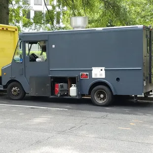 a yellow and a black food truck