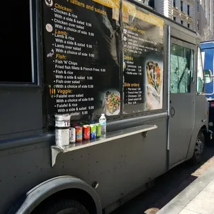 a food truck parked on the side of the street