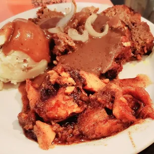 Meatloaf, mashed potatoes, and candied yams.