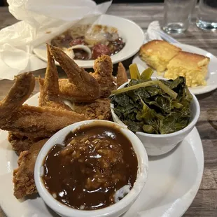 Four wings rice with gravy, collard greens