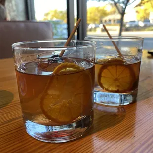 two glasses of iced tea on a table