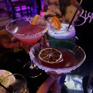 a close up of two cocktails
