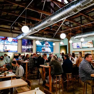 a large group of people sitting at tables