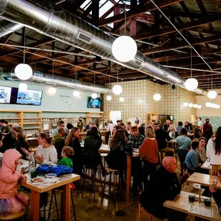 a large group of people sitting at tables