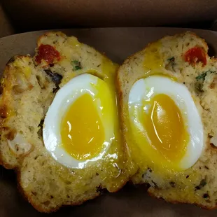 Breakfast muffin with 3 cheeses, roasted potatoes and a soft boiled egg