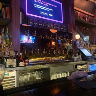 a bar with a large screen