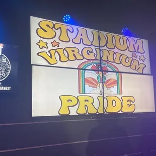 a stage with a sign that says stadium yum yum pride