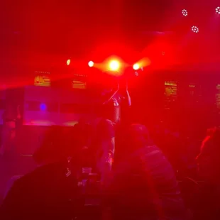 a group of people sitting at a bar