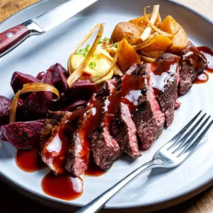 Flank Steak with sweet and sour beets, horseradish flan and red wine jus.