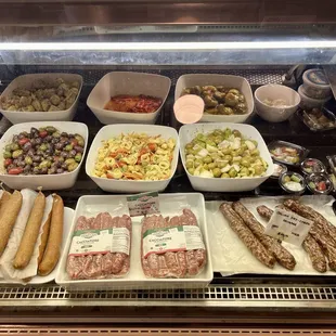 Sausages and salads in the deli case