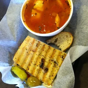 Tomato and mini ravioli bowl of soup and 1/2 panini