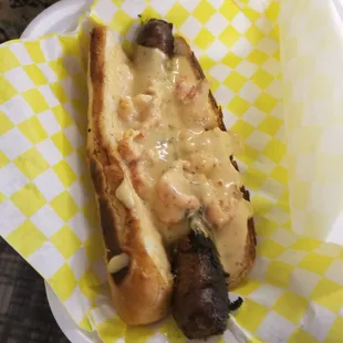 Sausage dawg with crawfish etouffee (he said it was worth the $10)