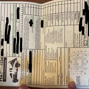 a hand holding a menu