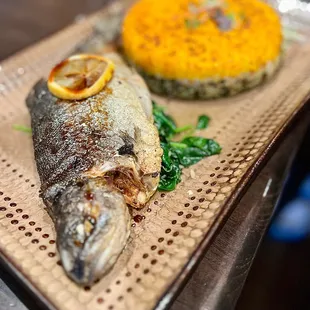 a whole fish and a side dish